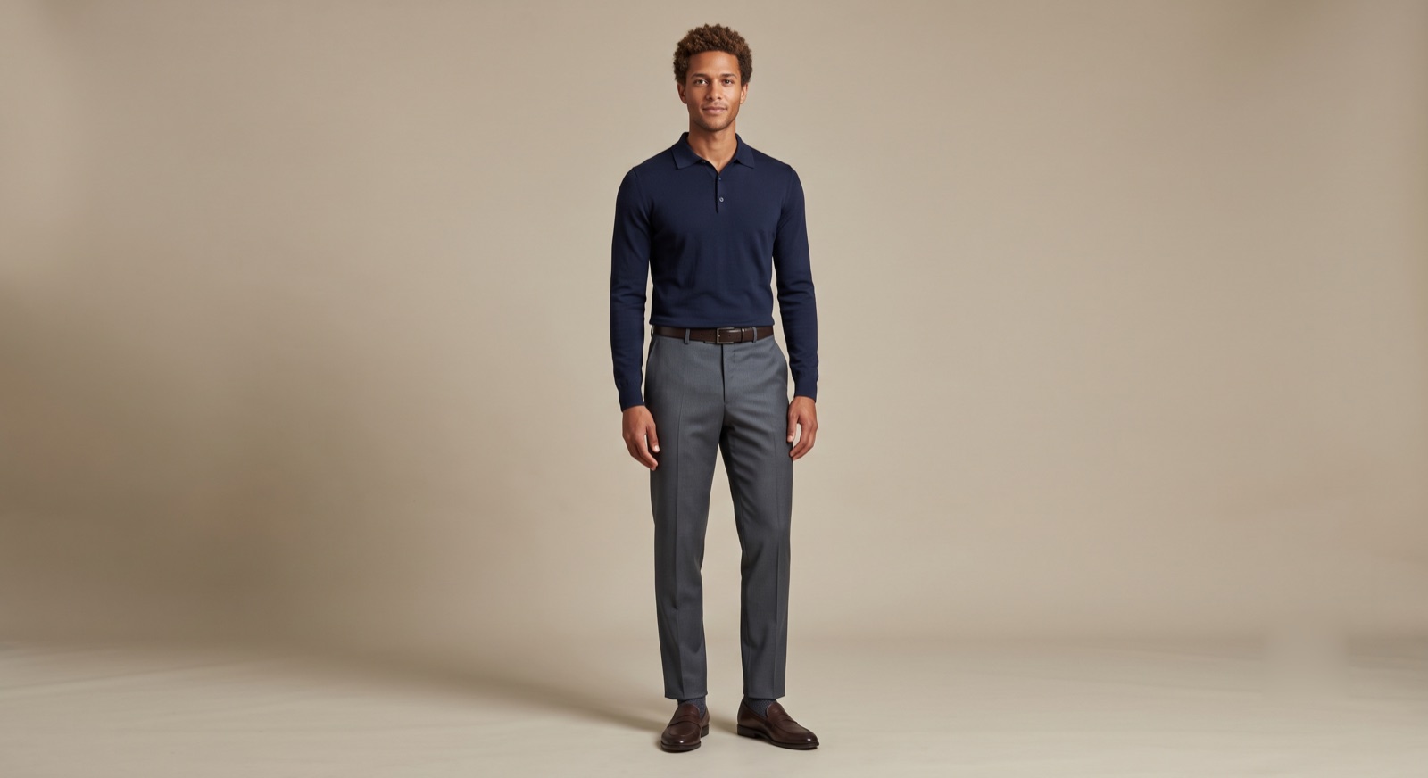 A man in slate Landivar dress pants and a navy polo